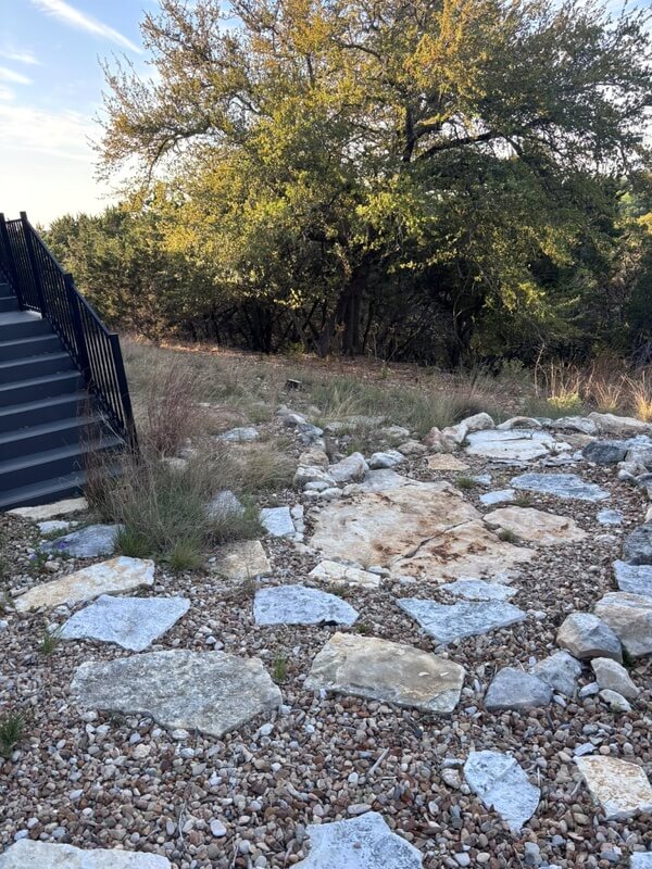 Rocky backyard terrain in Canyon Lake, Texas, showing typical scorpion hiding spots in limestone and river rock.